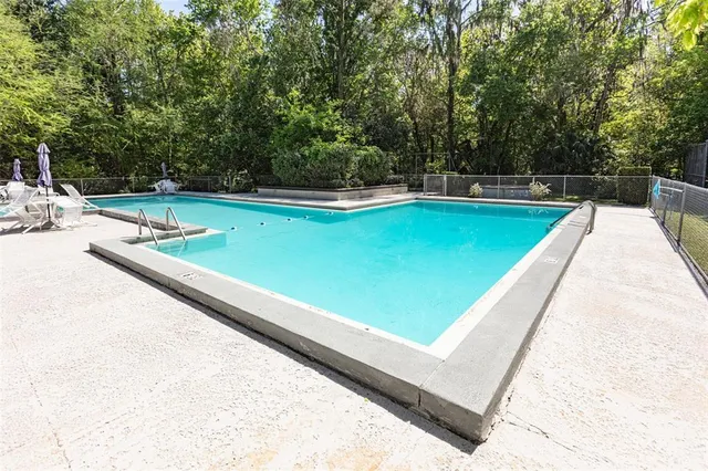 a view of a backyard with a small pool
