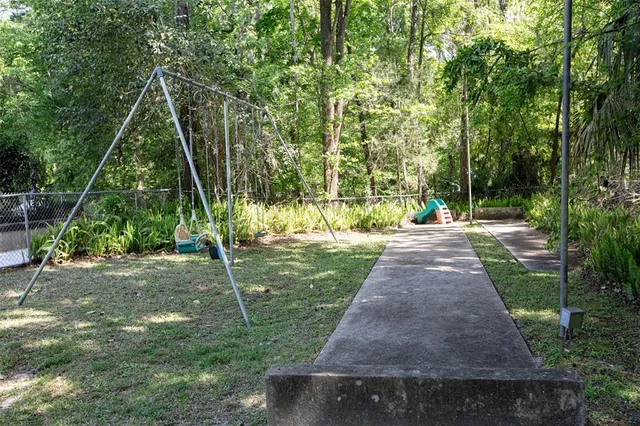 a view of green field with trees