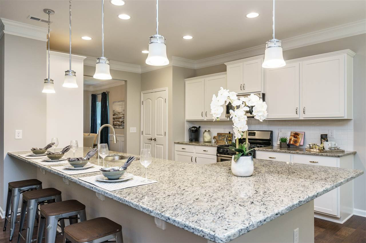 49 Springhill Lane Garner, NC 27529 - Photo 7 of 15 Kitchen with large granite countertop for extra seating. Representative