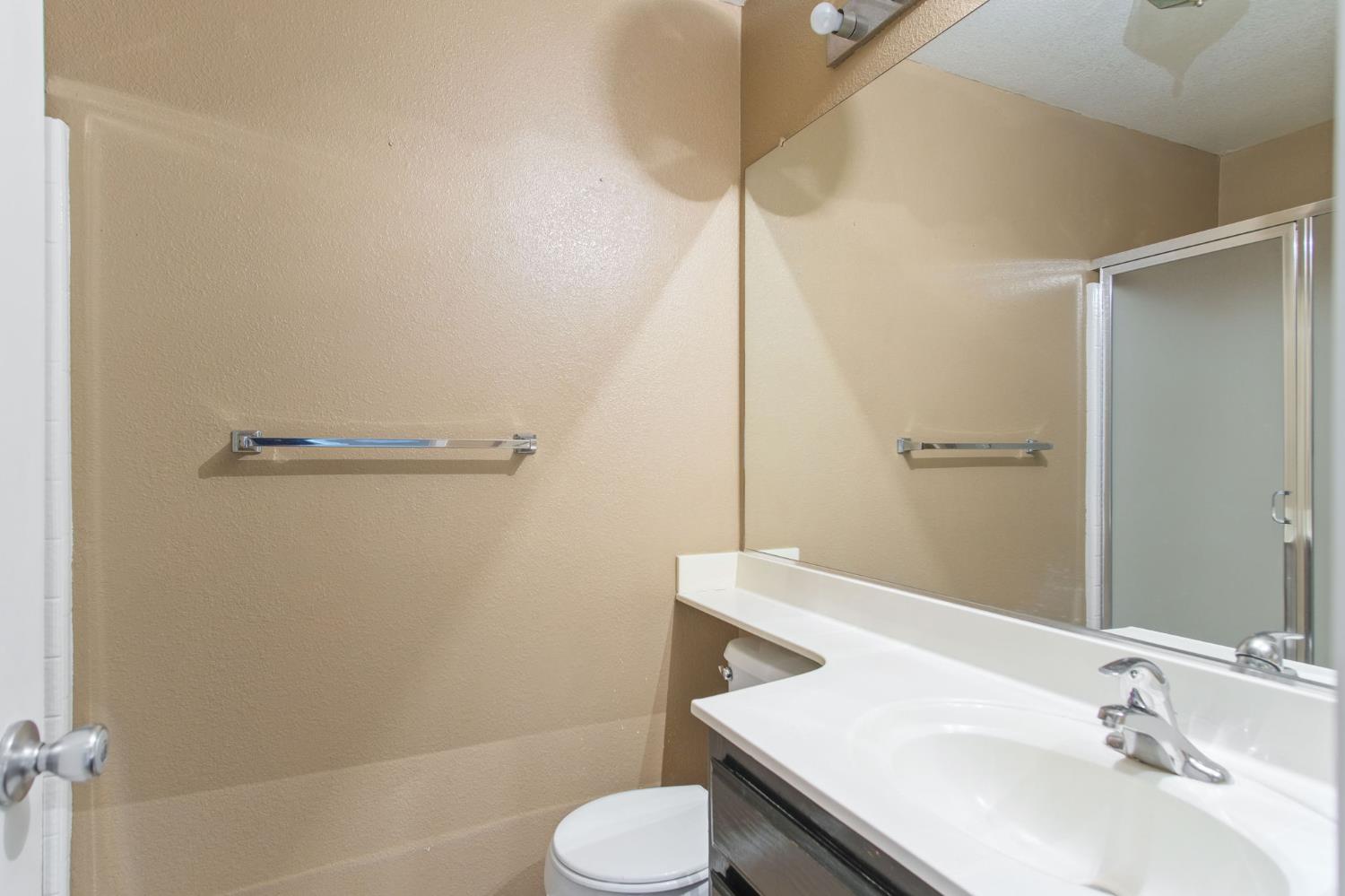 810 River Raft Court Modesto, CA 95351 - Photo 11 of 32 a bathroom with a sink toilet and shower