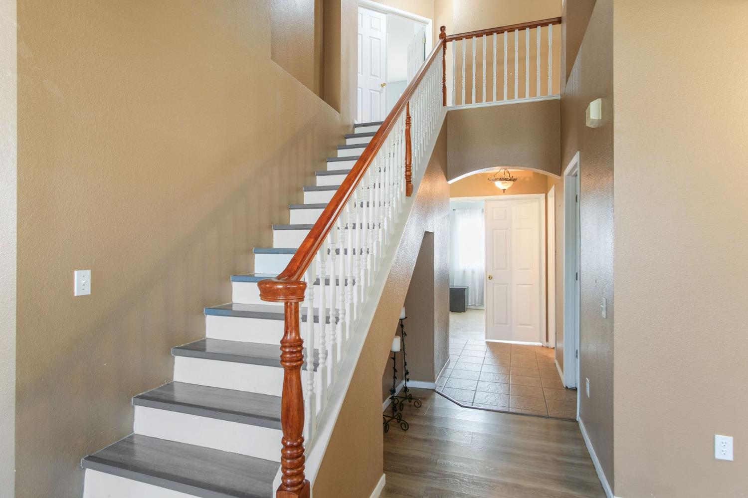 810 River Raft Court Modesto, CA 95351 - Photo 12 of 32 a view of staircase with wooden floor and white walls