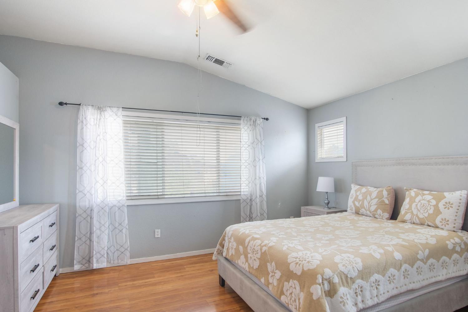 810 River Raft Court Modesto, CA 95351 - Photo 16 of 32 a bedroom with a bed and a window