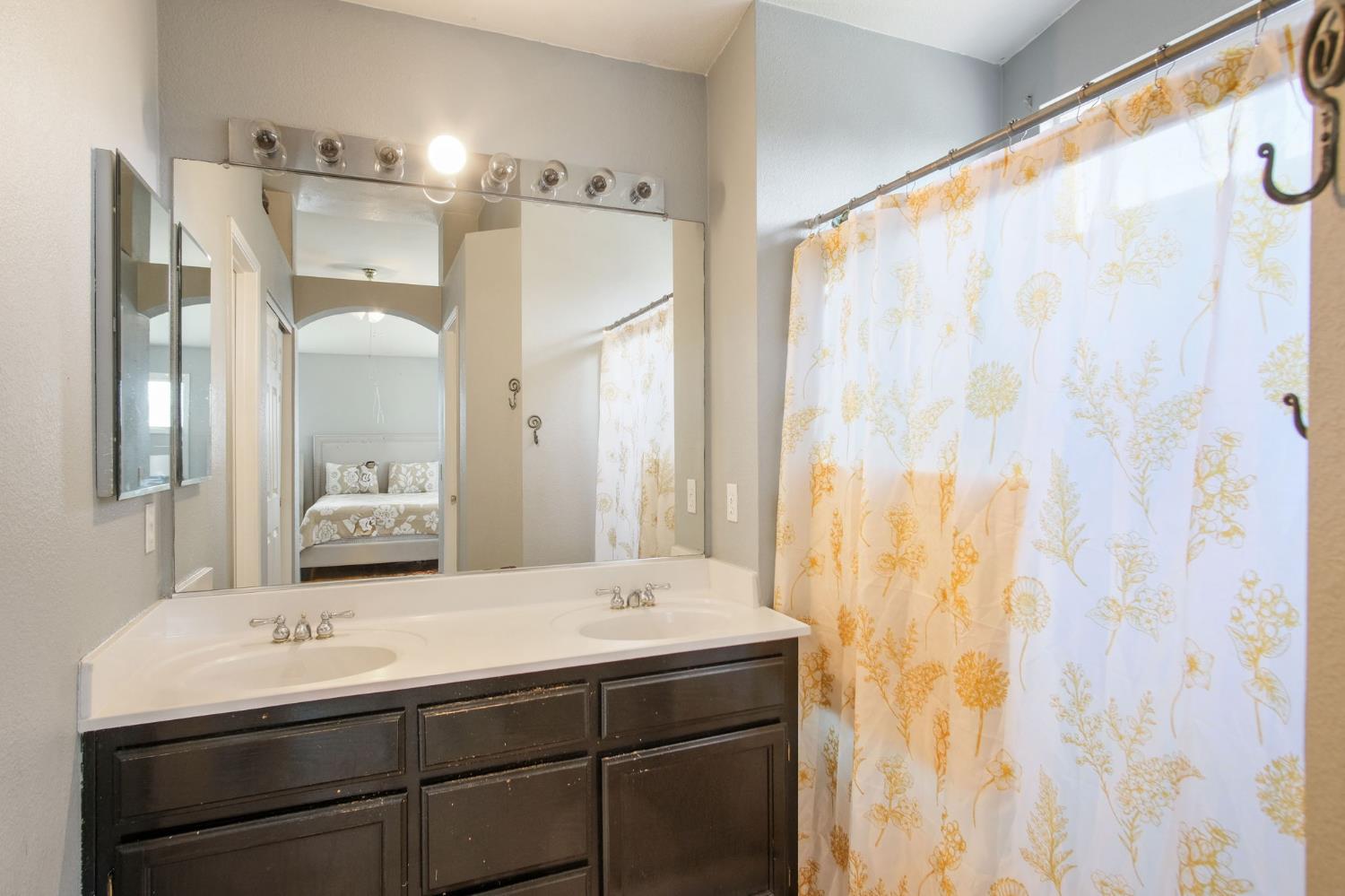 810 River Raft Court Modesto, CA 95351 - Photo 18 of 32 a bathroom with a sink and a mirror