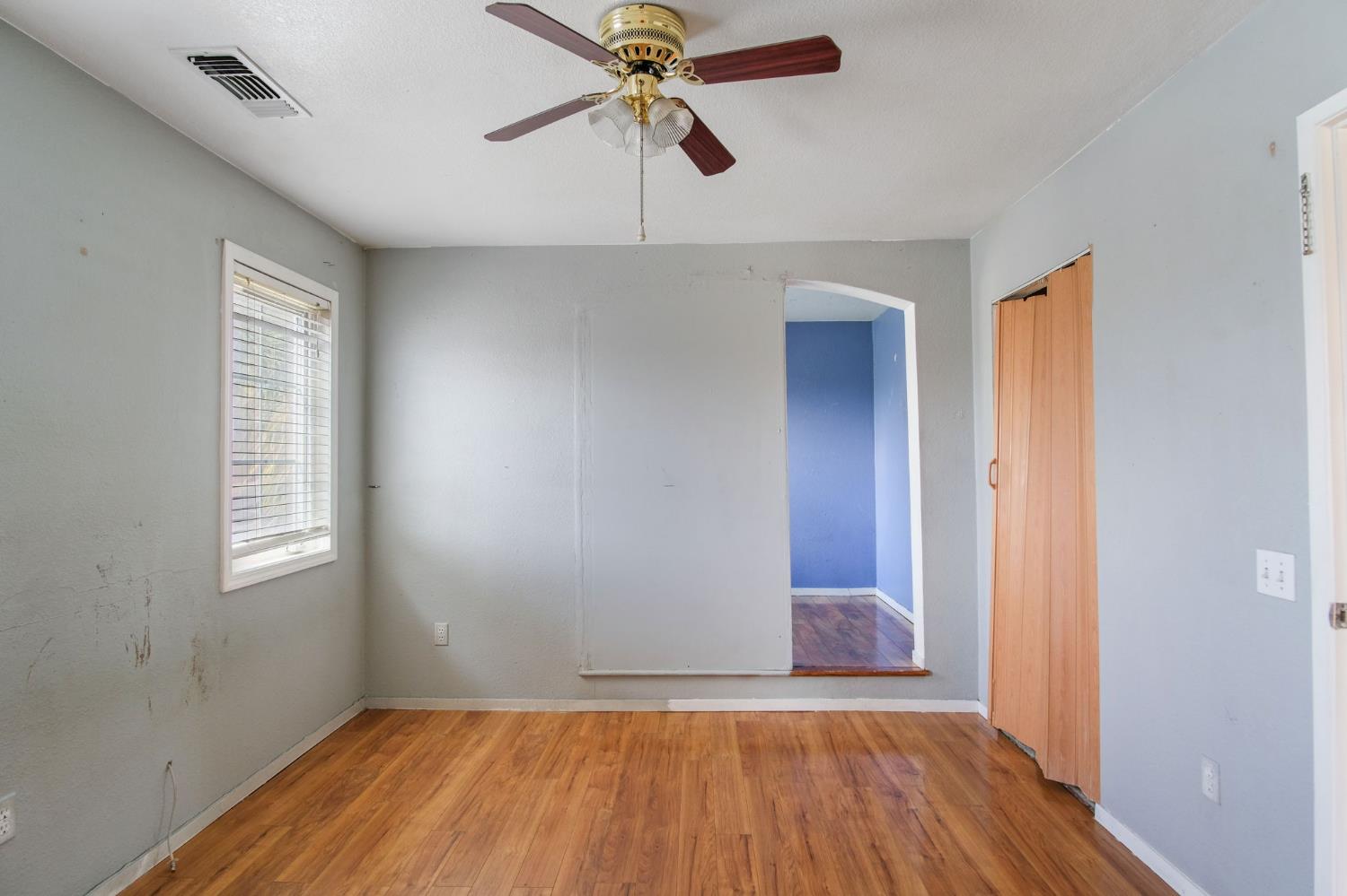810 River Raft Court Modesto, CA 95351 - Photo 21 of 32 a view of a room with wooden floor and ceiling fan