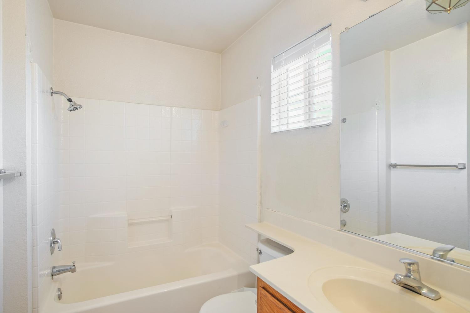 810 River Raft Court Modesto, CA 95351 - Photo 23 of 32 a bathroom with a sink toilet and shower