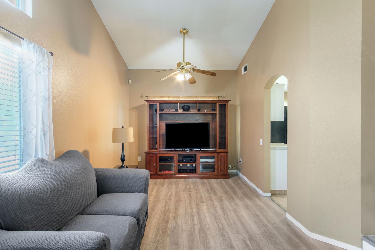 810 River Raft Court Modesto, CA 95351 - Photo 6 of 32 a living room with furniture and a chandelier