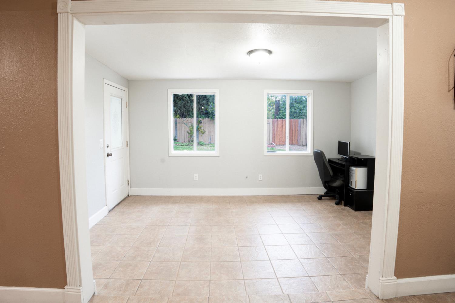 810 River Raft Court Modesto, CA 95351 - Photo 9 of 32 a view of an empty room with a window