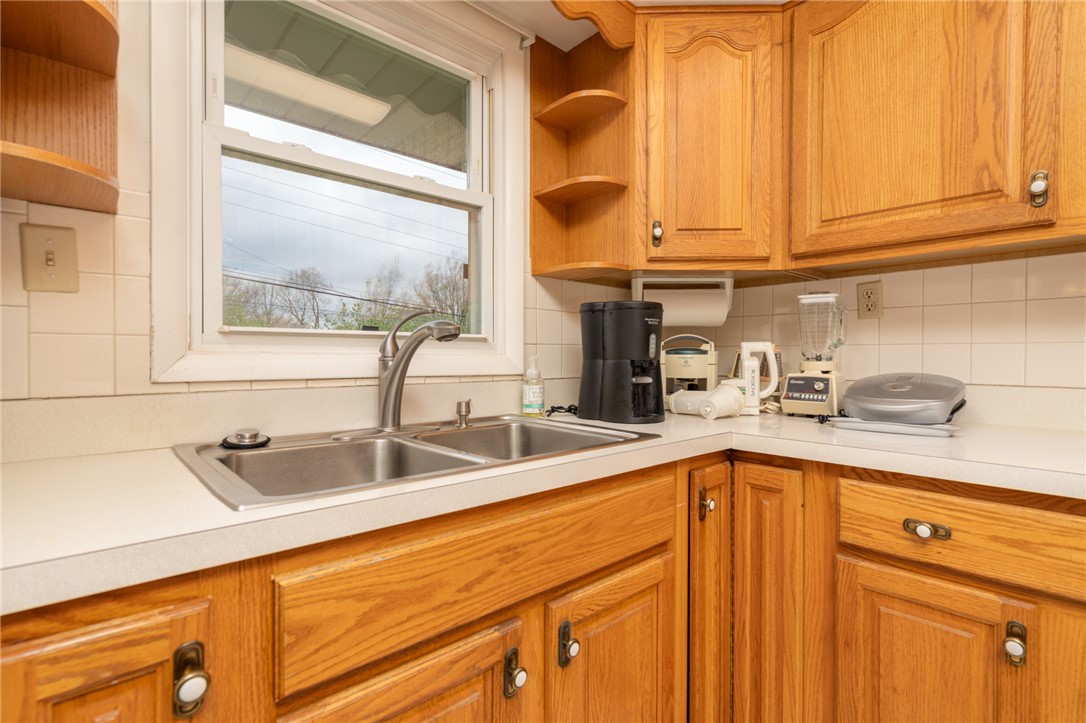 795 Spring Garden Place Dayton, OH 45431 - Photo 22 of 34 This kitchen offers practical counter space and storage, perfect for daily routines.