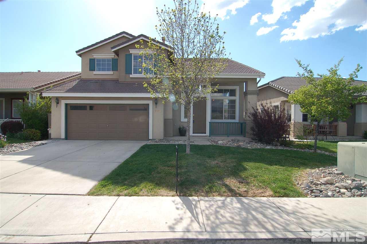 9833 Northrup Drive Reno, NV 89521 - Photo 1 of 1 a front view of a house with a yard and garage