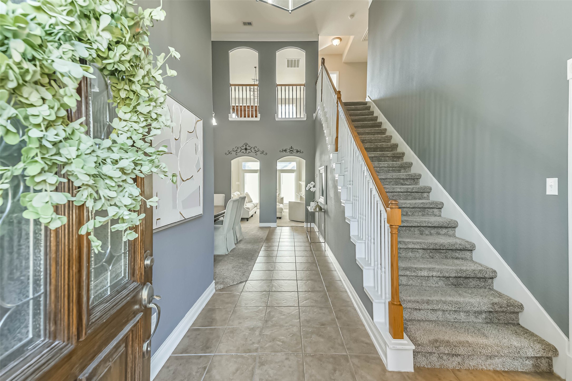 19022 Greenleaf Ridge Court Cypress, TX 77429 - Photo 8 of 47 a view of a hallway with wooden floor and entryway