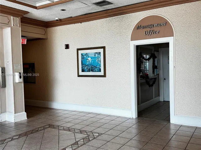 a view of front door with small backyard