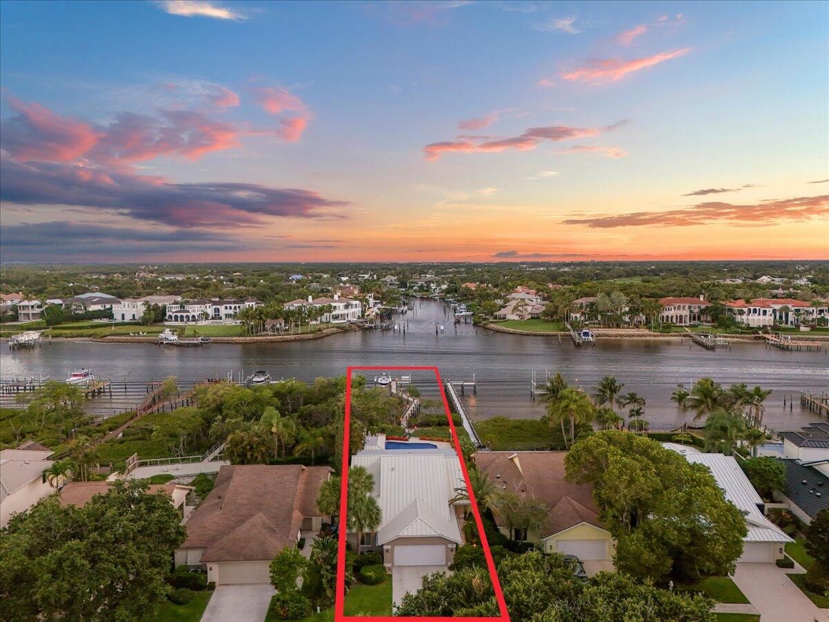 352 River Edge Road Jupiter, FL 33477 - Photo 44 of 56 Twilight aerial facing West