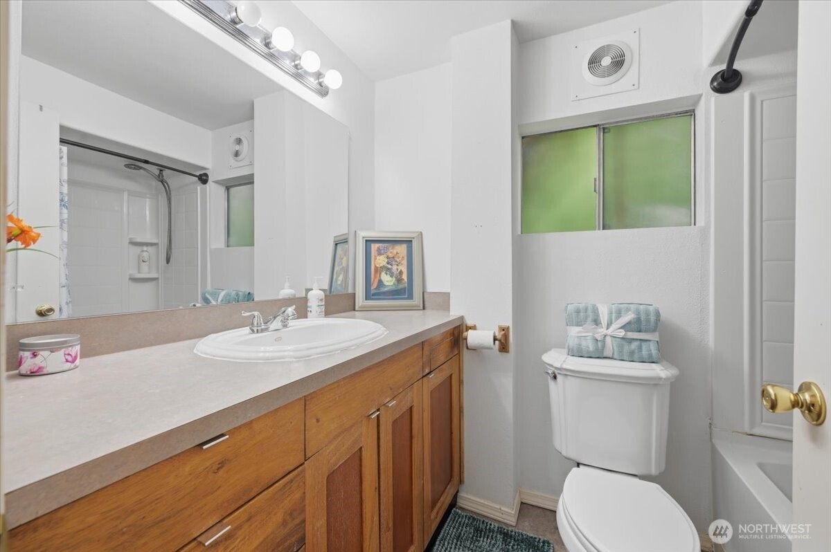23746 Old Day Creek Road, Unit A & B Sedro-Woolley, WA 98284 - Photo 18 of 36 a bathroom with a sink vanity mirror and toilet