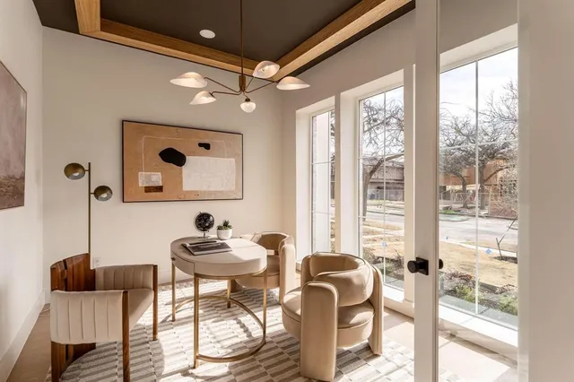 a work room with furniture and a large window