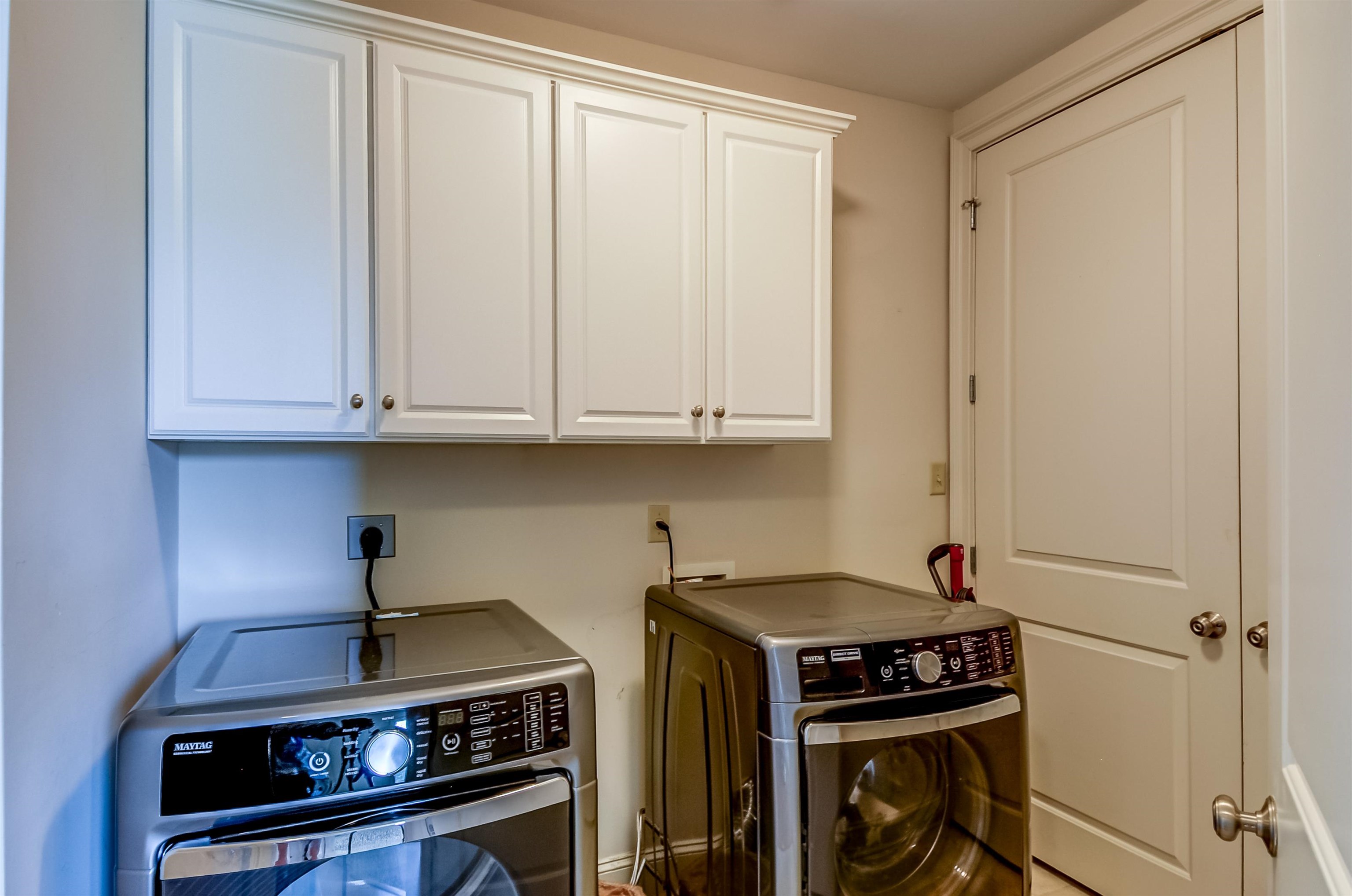 591 Lexington Road, Unit 303 Memphis, TN 38117 - Photo 24 of 34 a view of storage and utility room with washer and dryer
