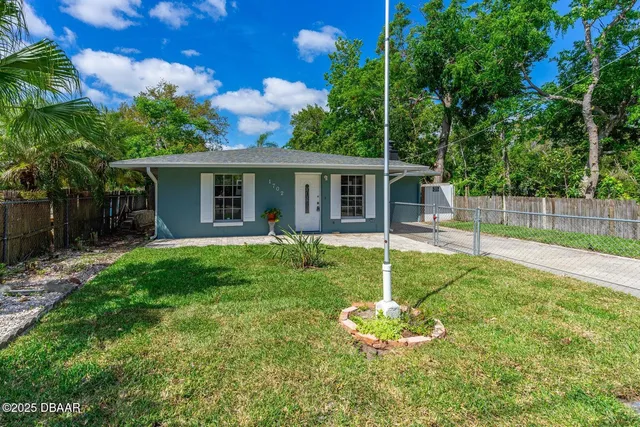 a house view with a garden space