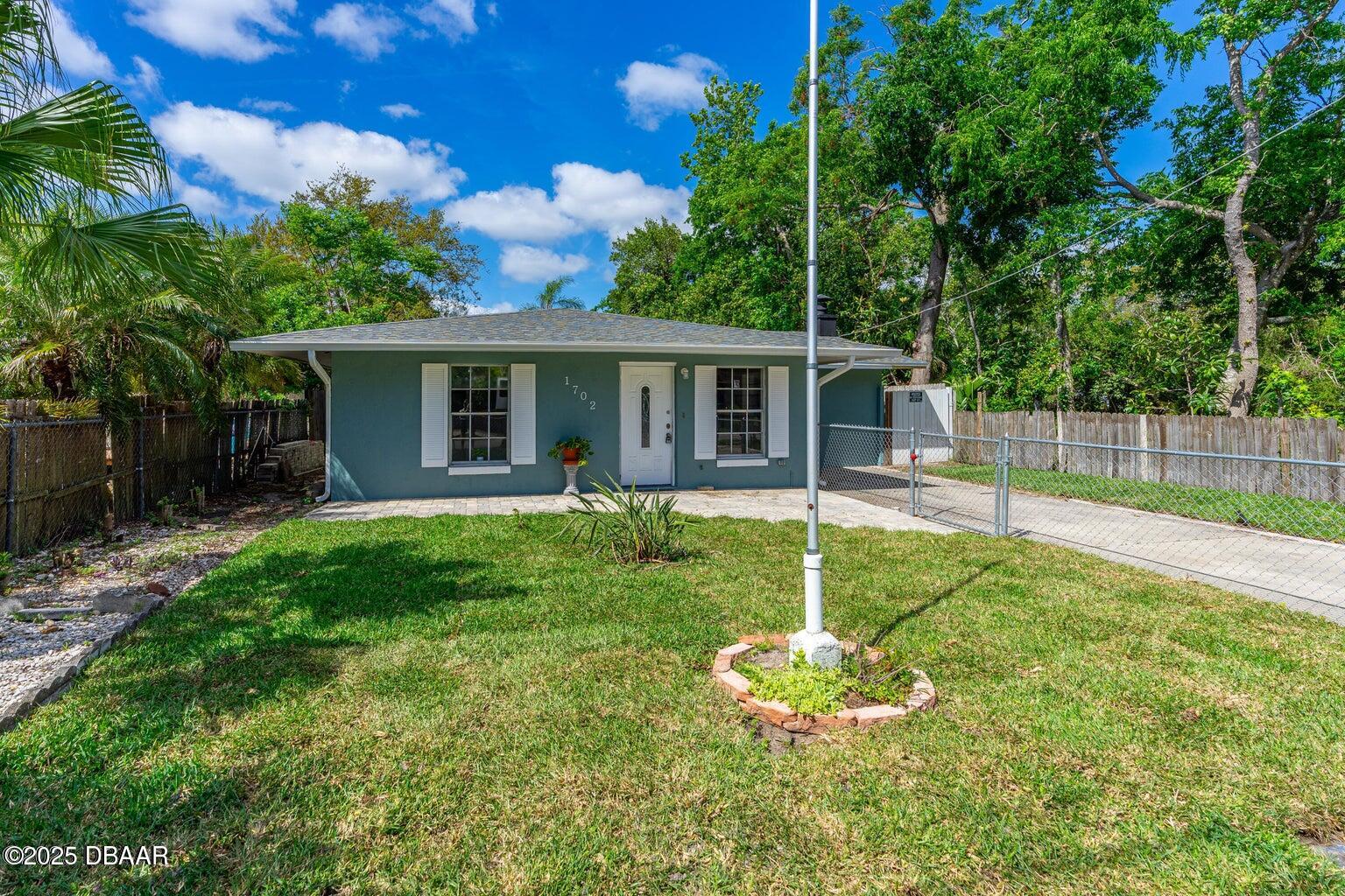 1702 Carolina Avenue Ormond Beach, FL 32174 - Photo 1 of 23 a house view with a garden space
