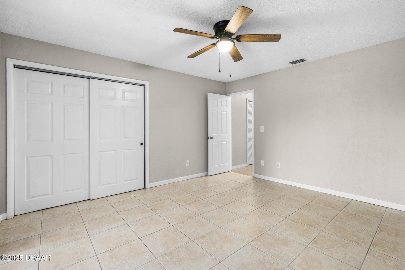 1702 Carolina Avenue Ormond Beach, FL 32174 - Photo 14 of 23 wooden floor in an empty room
