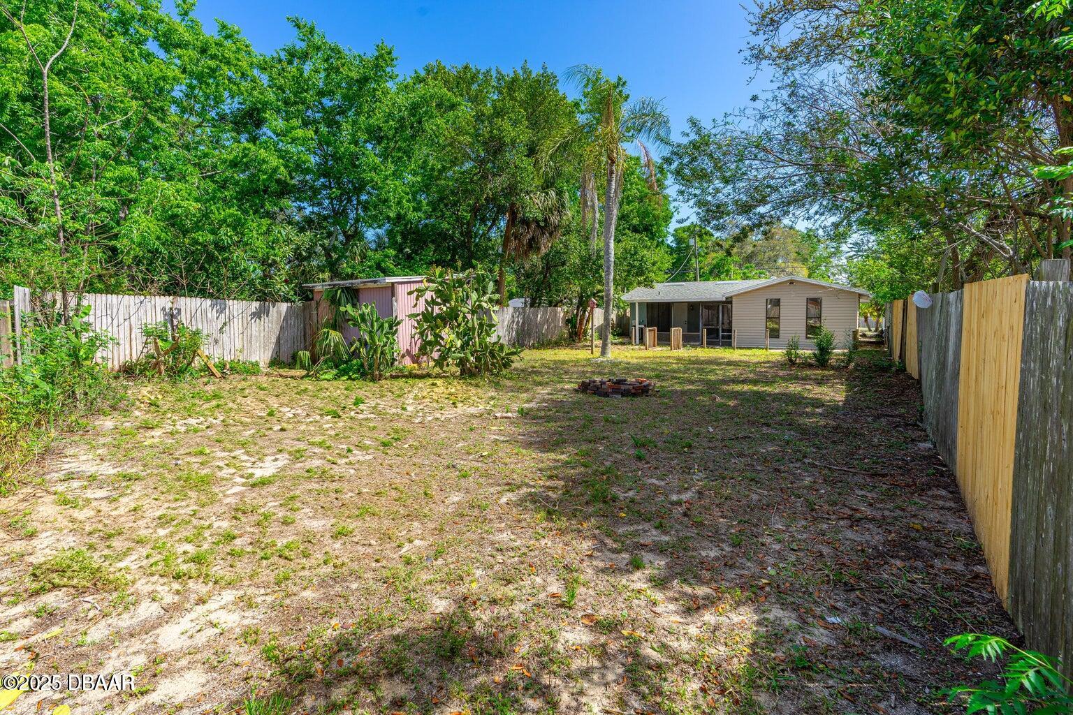 1702 Carolina Avenue Ormond Beach, FL 32174 - Photo 21 of 23 a view of a house with backyard and sitting area
