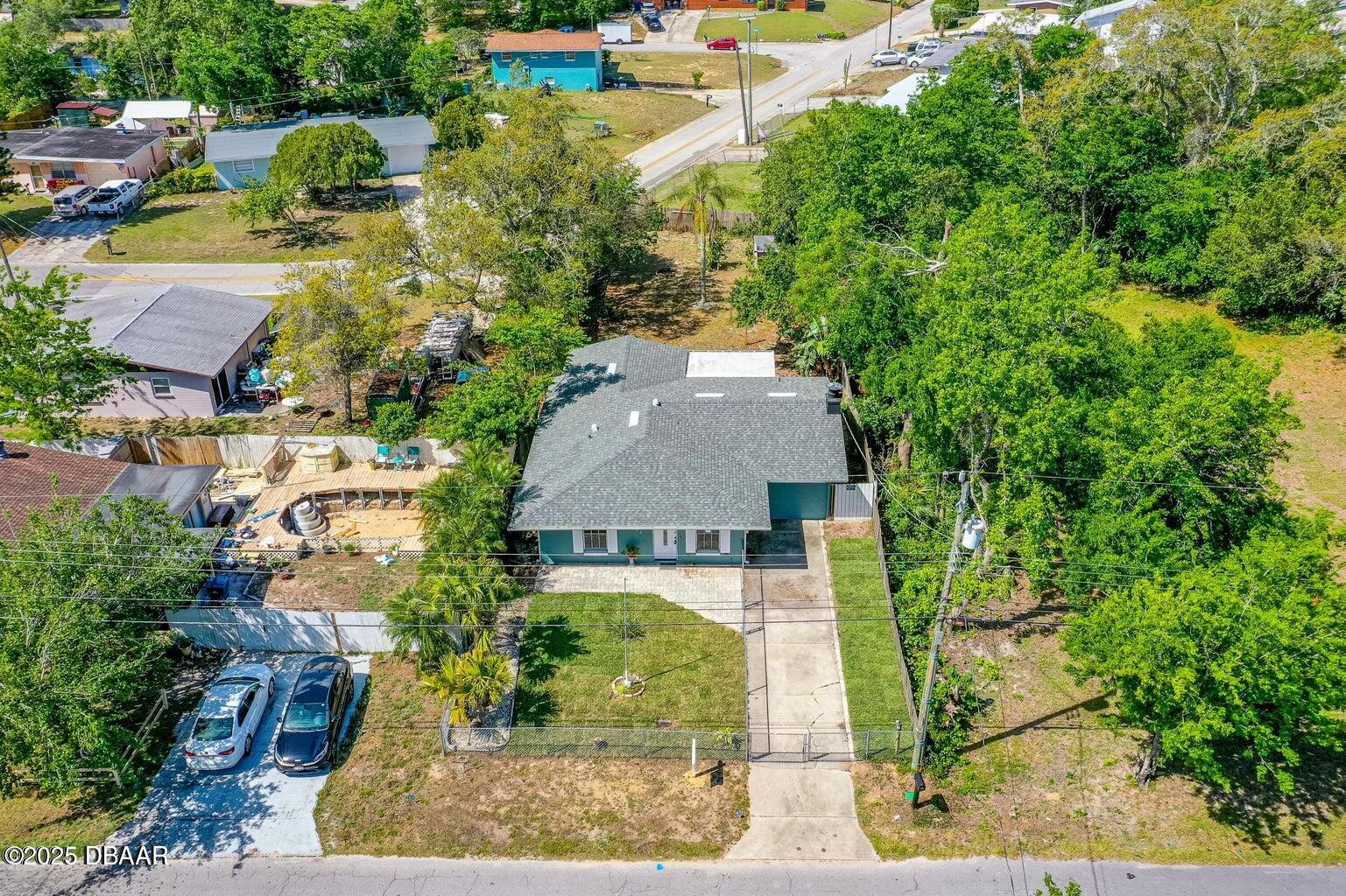 1702 Carolina Avenue Ormond Beach, FL 32174 - Photo 22 of 23 an aerial view of a house with a yard basket ball court and outdoor seating