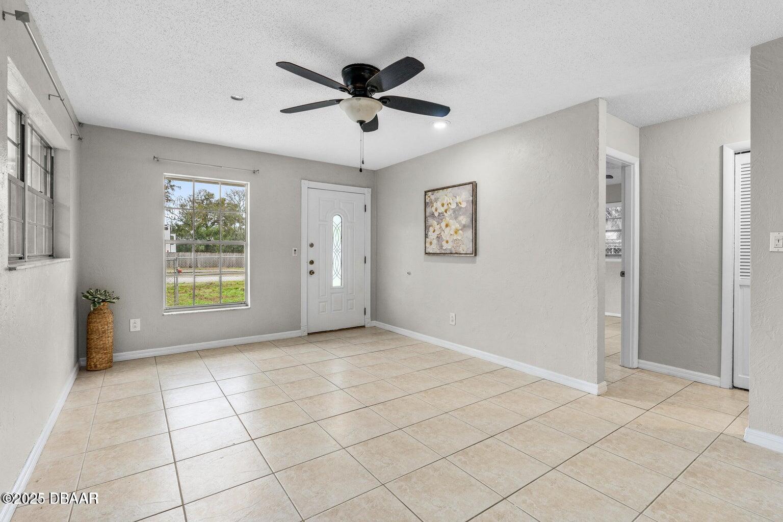 1702 Carolina Avenue Ormond Beach, FL 32174 - Photo 4 of 23 a view of an empty room with a window