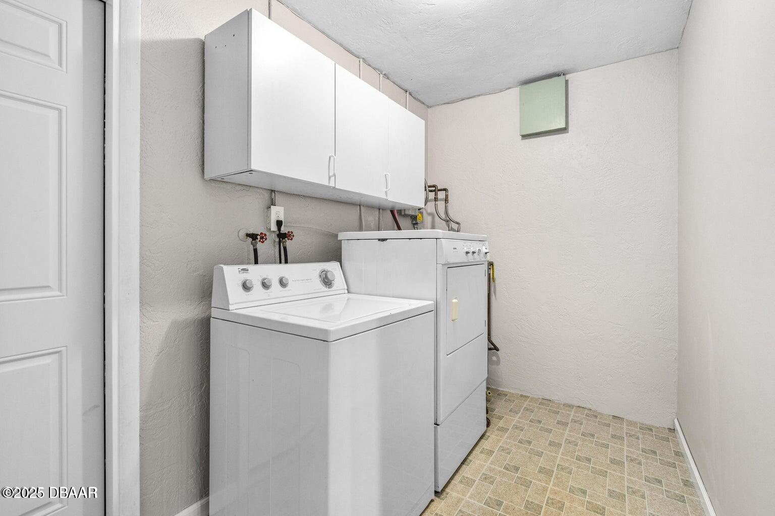 1702 Carolina Avenue Ormond Beach, FL 32174 - Photo 10 of 23 a utility room with dryer and washer