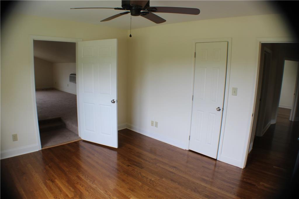 4123 Hickory Nut Ridge Road Hudson, NC 28638 - Photo 12 of 27 wooden floor in an empty room