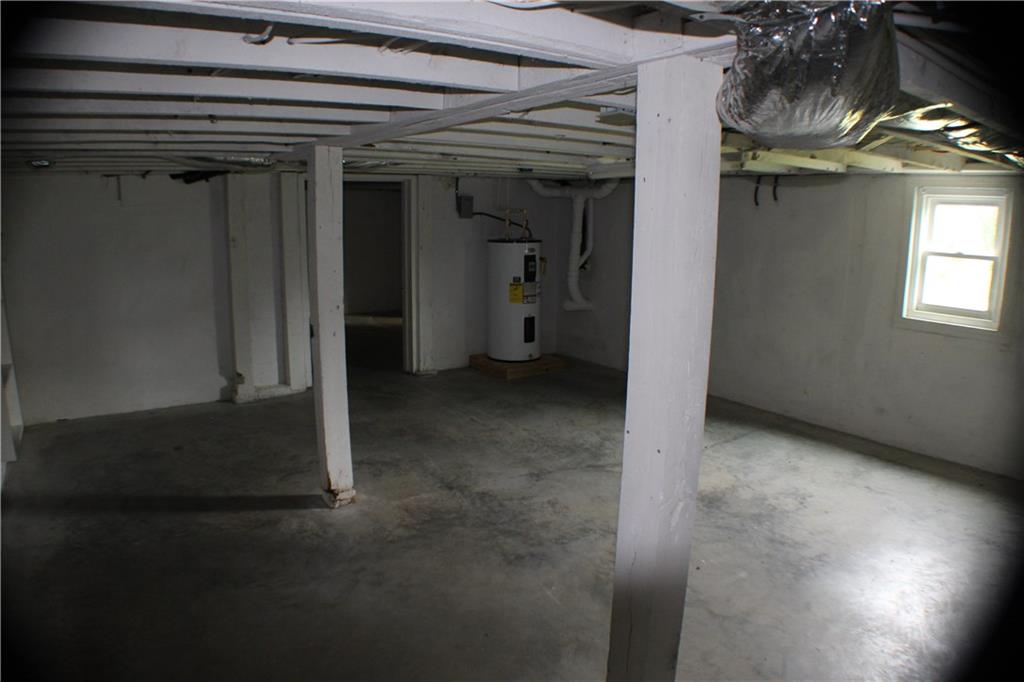 4123 Hickory Nut Ridge Road Hudson, NC 28638 - Photo 20 of 27 a view of a livingroom with an empty space and a window