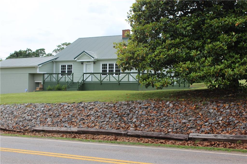 4123 Hickory Nut Ridge Road Hudson, NC 28638 - Photo 23 of 27 a view of a house with a garden