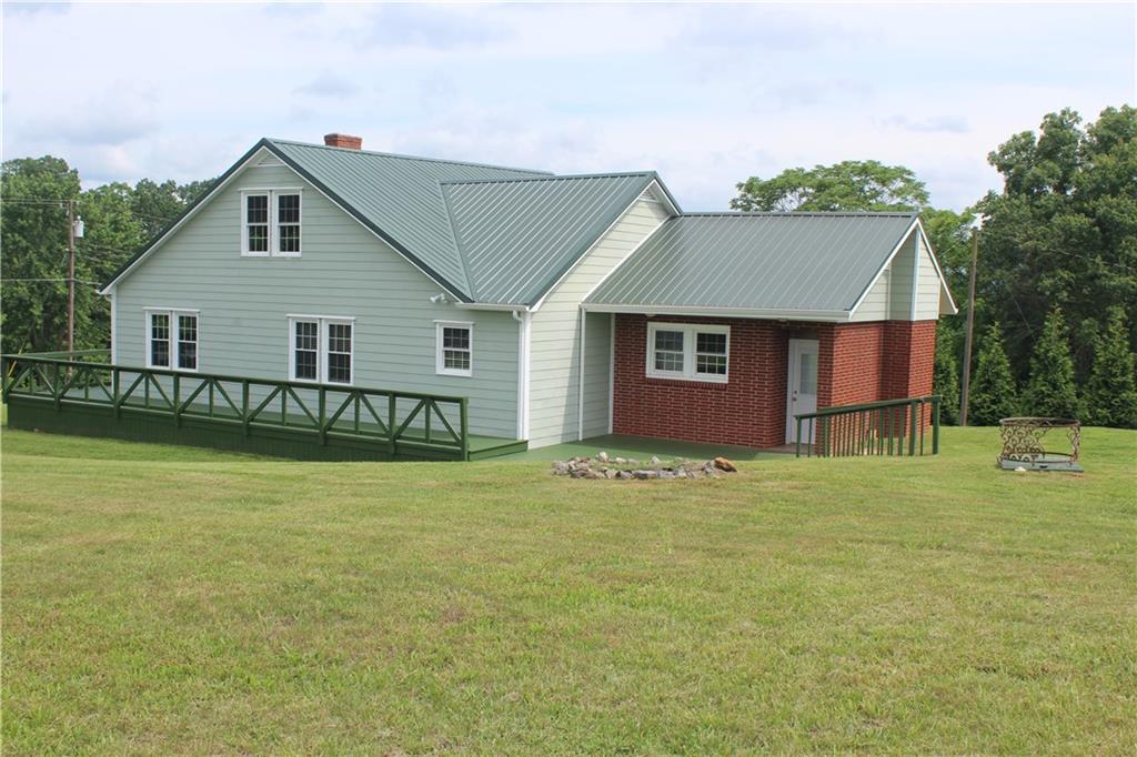 4123 Hickory Nut Ridge Road Hudson, NC 28638 - Photo 26 of 27 a front view of a house with garden