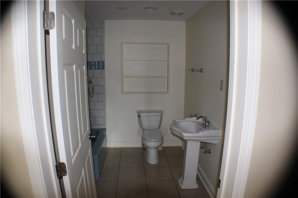 4123 Hickory Nut Ridge Road Hudson, NC 28638 - Photo 10 of 27 a bathroom with a sink toilet and shower