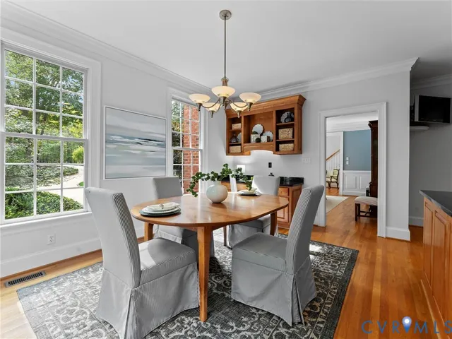 a room with pool table and windows