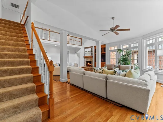a view of a yard with wooden fence