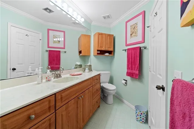 a bathroom with a sink vanity and a mirror