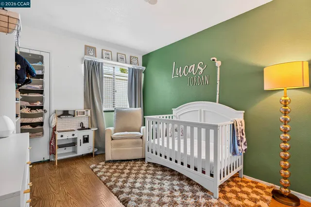 a bedroom with furniture and a window