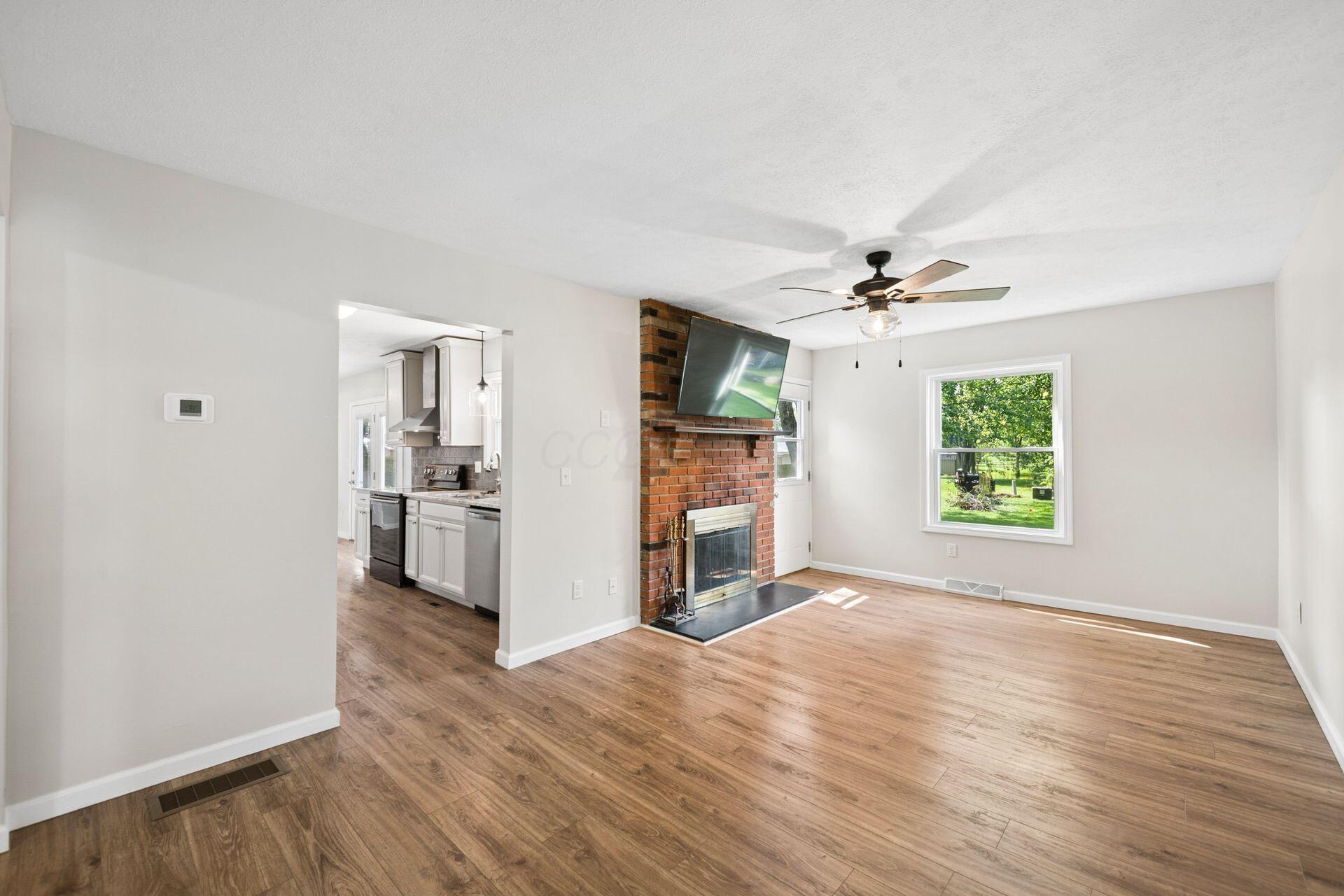 417 Forward Pass Road Southwest Pataskala, OH 43062 - Photo 17 of 53 Open Concept family room w/fireplace