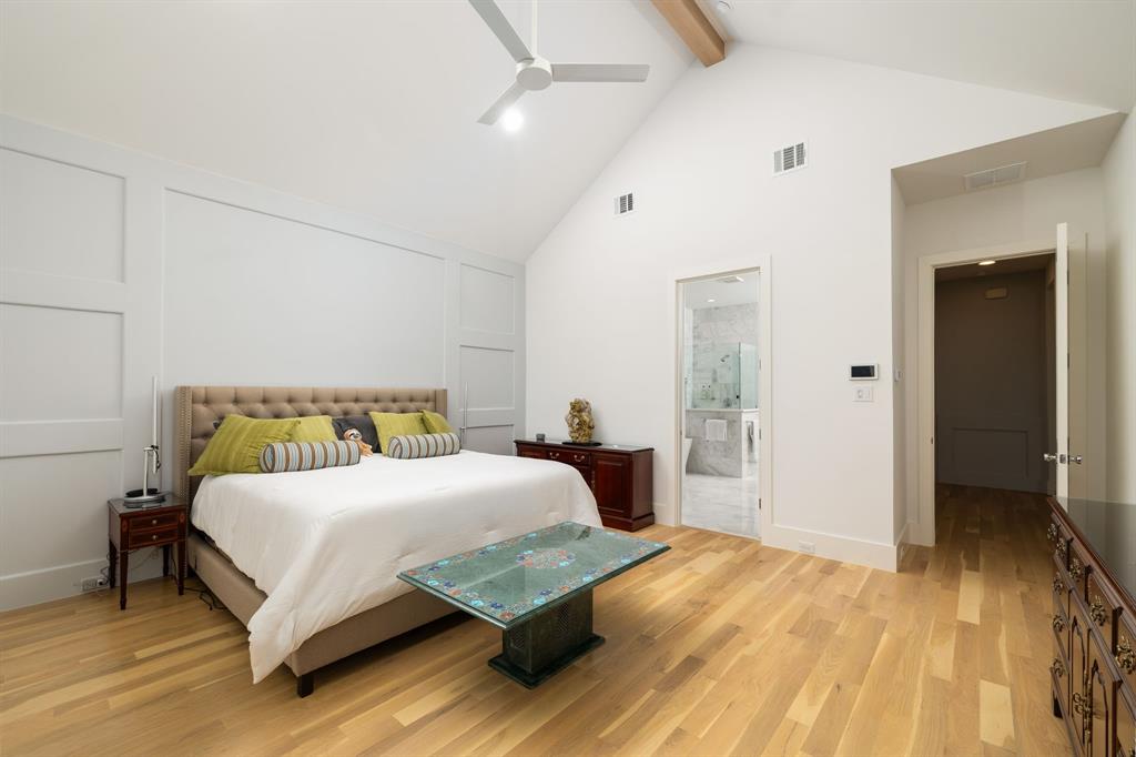 5019 Lark Lane Dallas, TX 75209 - Photo 12 of 32 a bedroom with a bed and closet with wooden floor