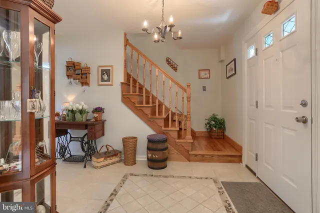 a kitchen with stainless steel appliances granite countertop a sink a stove and a wooden floors