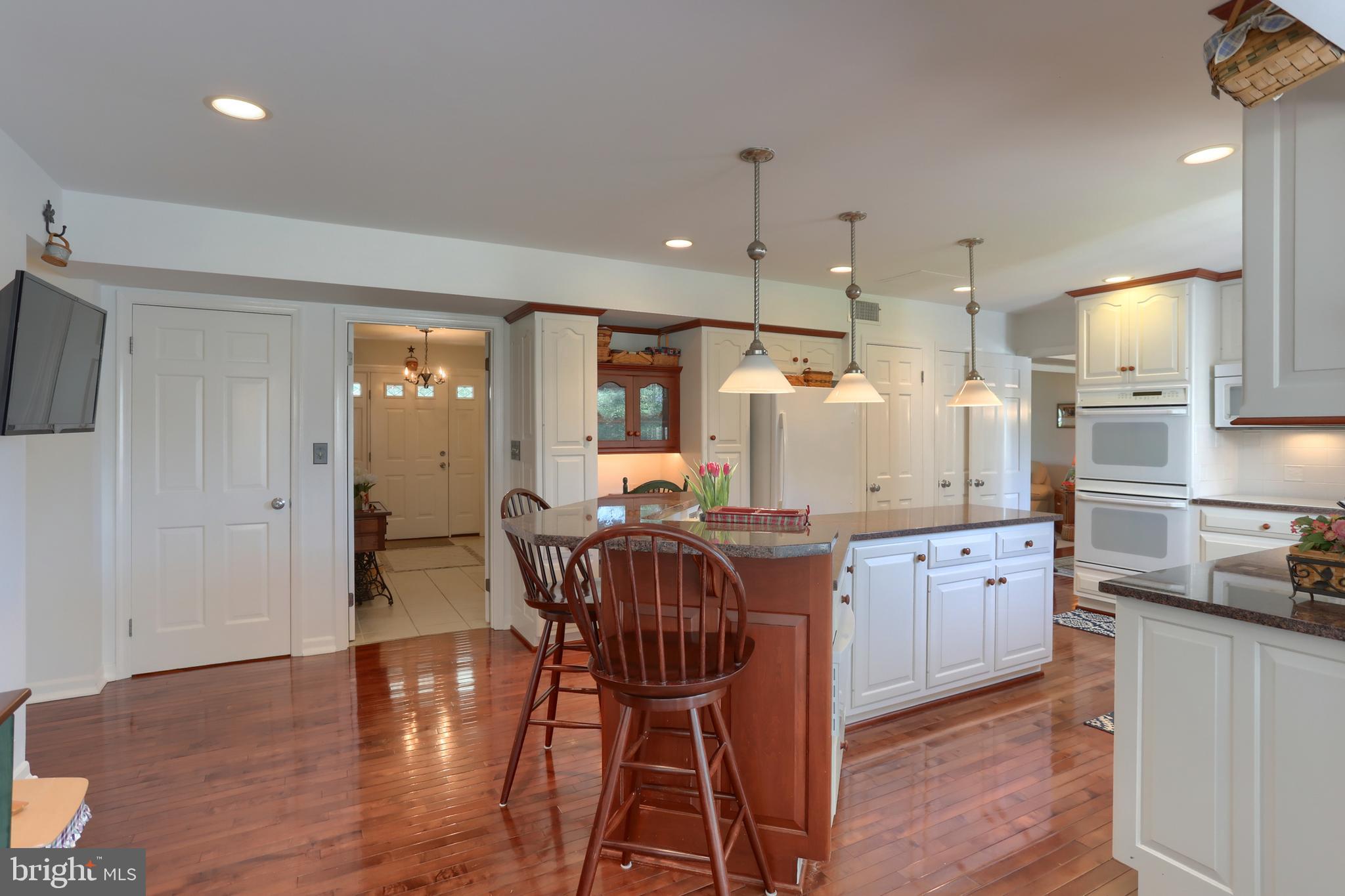 3 Banbury Road Hummelstown, PA 17036 - Photo 23 of 85 a kitchen with stainless steel appliances granite countertop a kitchen island hardwood floor and a sink