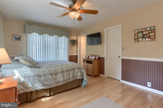 a aerial view of a house with a yard table and chairs
