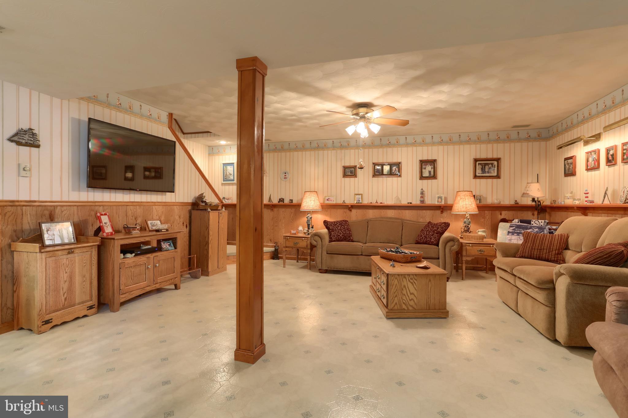 3 Banbury Road Hummelstown, PA 17036 - Photo 48 of 85 a living room with furniture and a flat screen tv