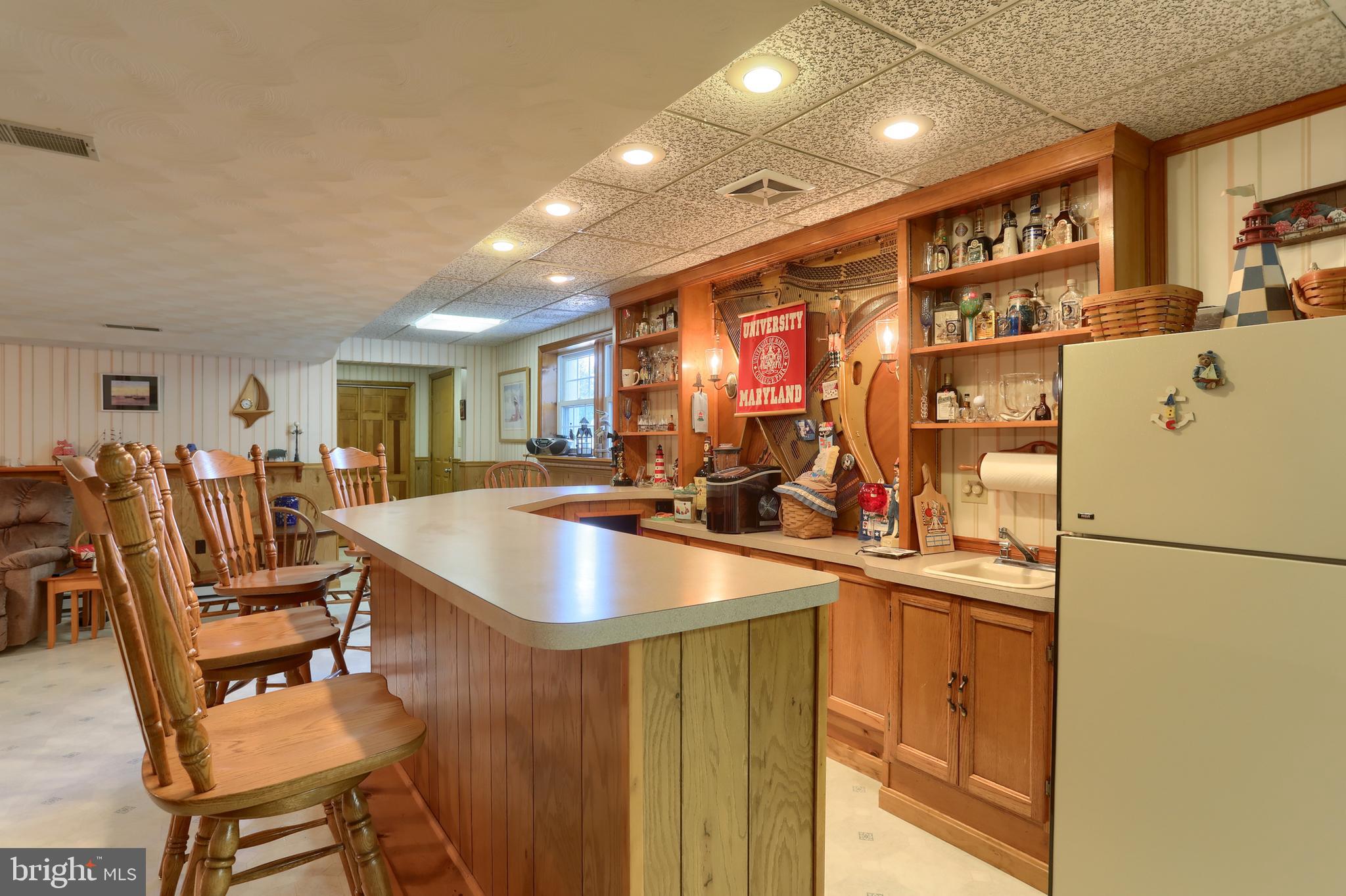 3 Banbury Road Hummelstown, PA 17036 - Photo 51 of 85 a kitchen with stainless steel appliances granite countertop a dining table chairs and a refrigerator