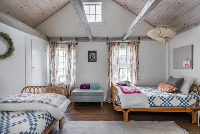 a bedroom with furniture and windows