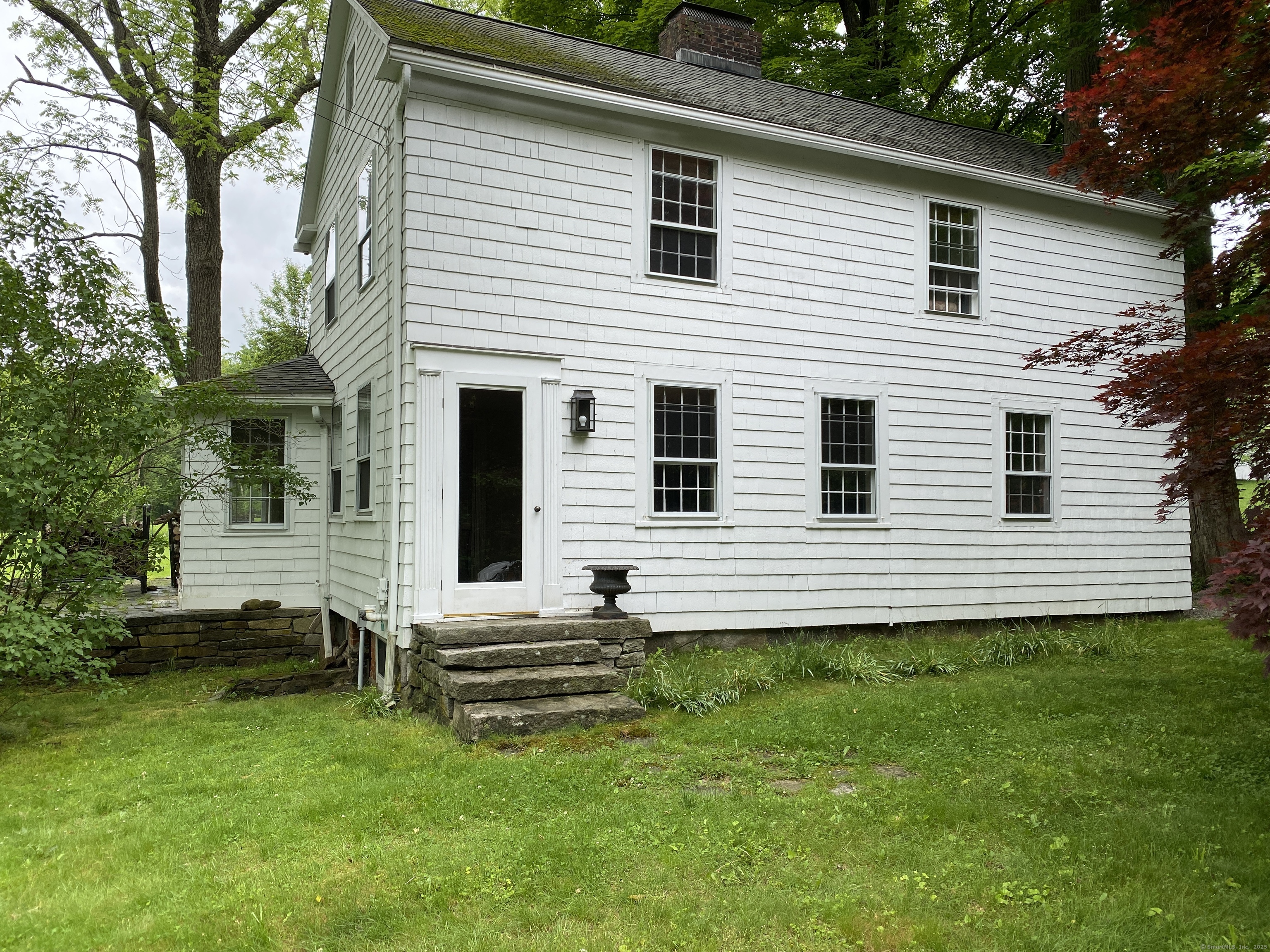 37 South Street Roxbury, CT 06783 - Photo 2 of 20 a view of a house with a yard and a large tree