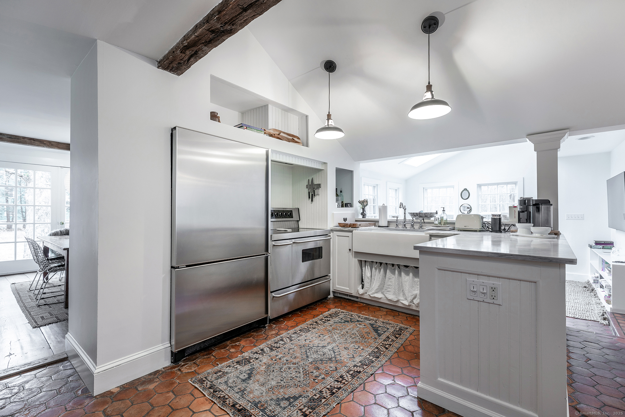 37 South Street Roxbury, CT 06783 - Photo 4 of 20 a kitchen with stainless steel appliances granite countertop a refrigerator a sink dishwasher a stove and white cabinets with wooden floor