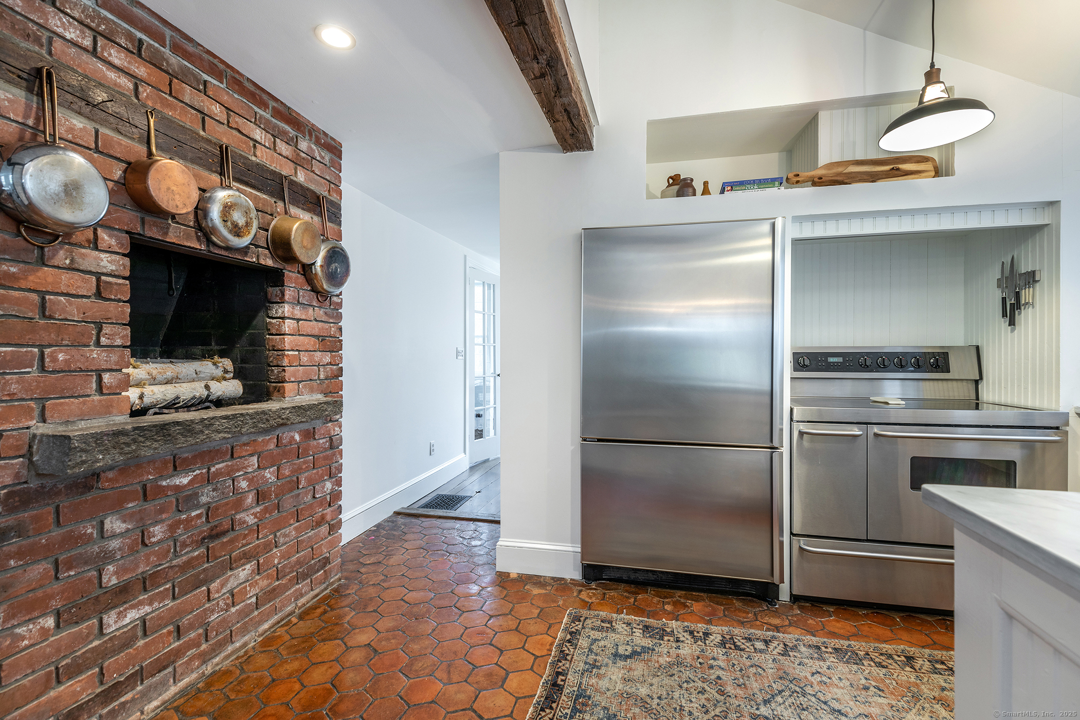 37 South Street Roxbury, CT 06783 - Photo 6 of 20 a kitchen with granite countertop a refrigerator stove and microwave