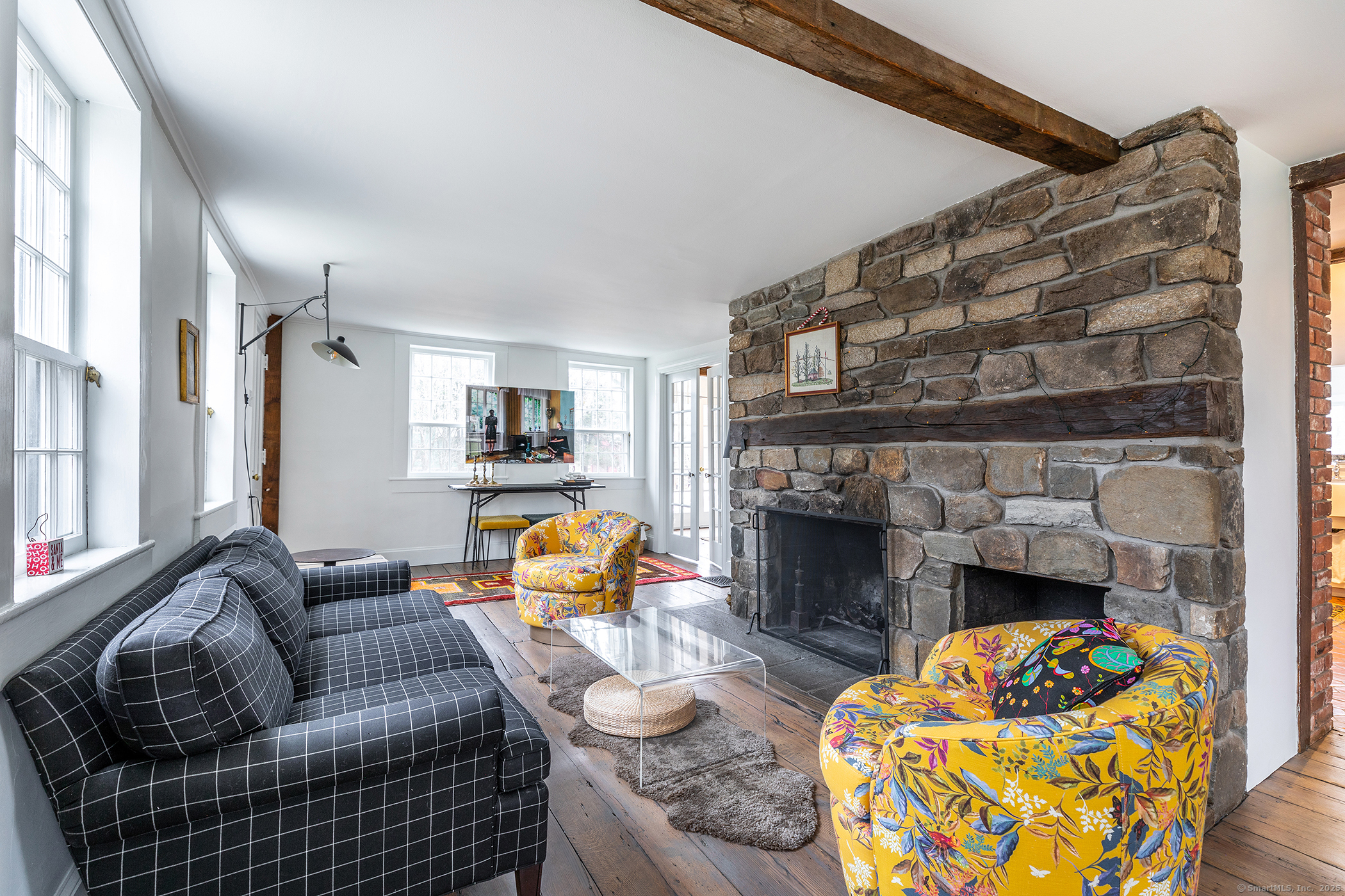 37 South Street Roxbury, CT 06783 - Photo 7 of 20 a living room with furniture and a fireplace
