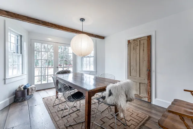 a view of a livingroom with furniture and a table