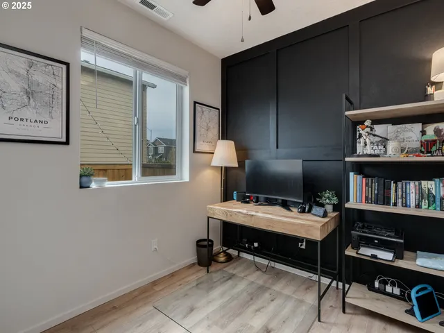 a workspace with furniture and book shelf
