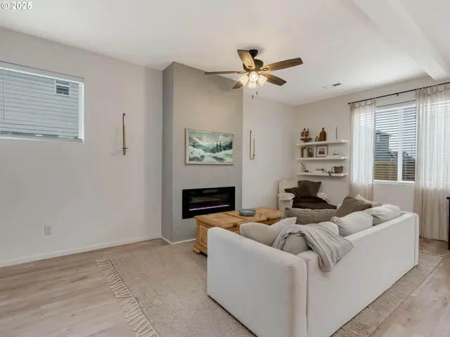a living room with furniture and a window